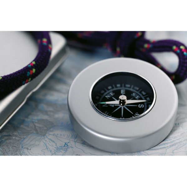 A nautical compass designed for navigation at sea featuring clear markings and a stable base for accurate readings
